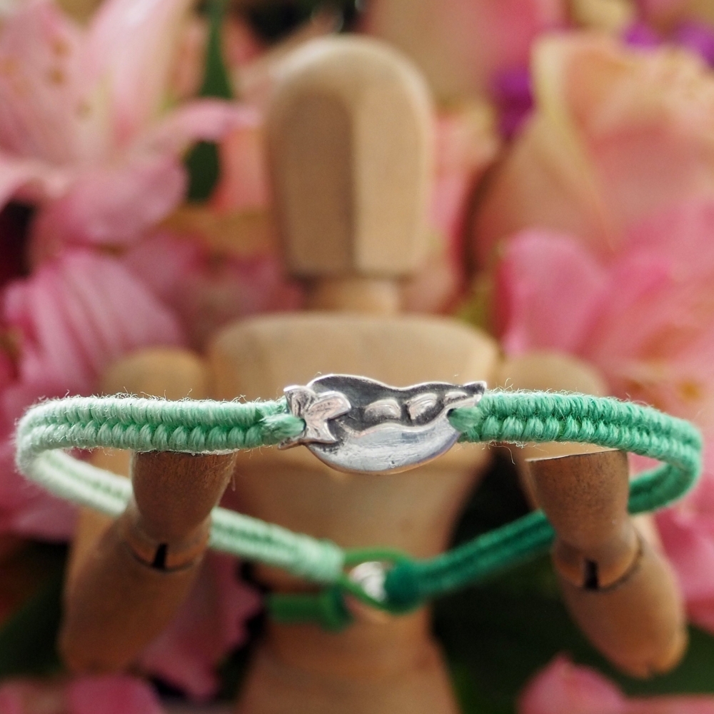 Fine silver palm tree charm on green friendship bracelet