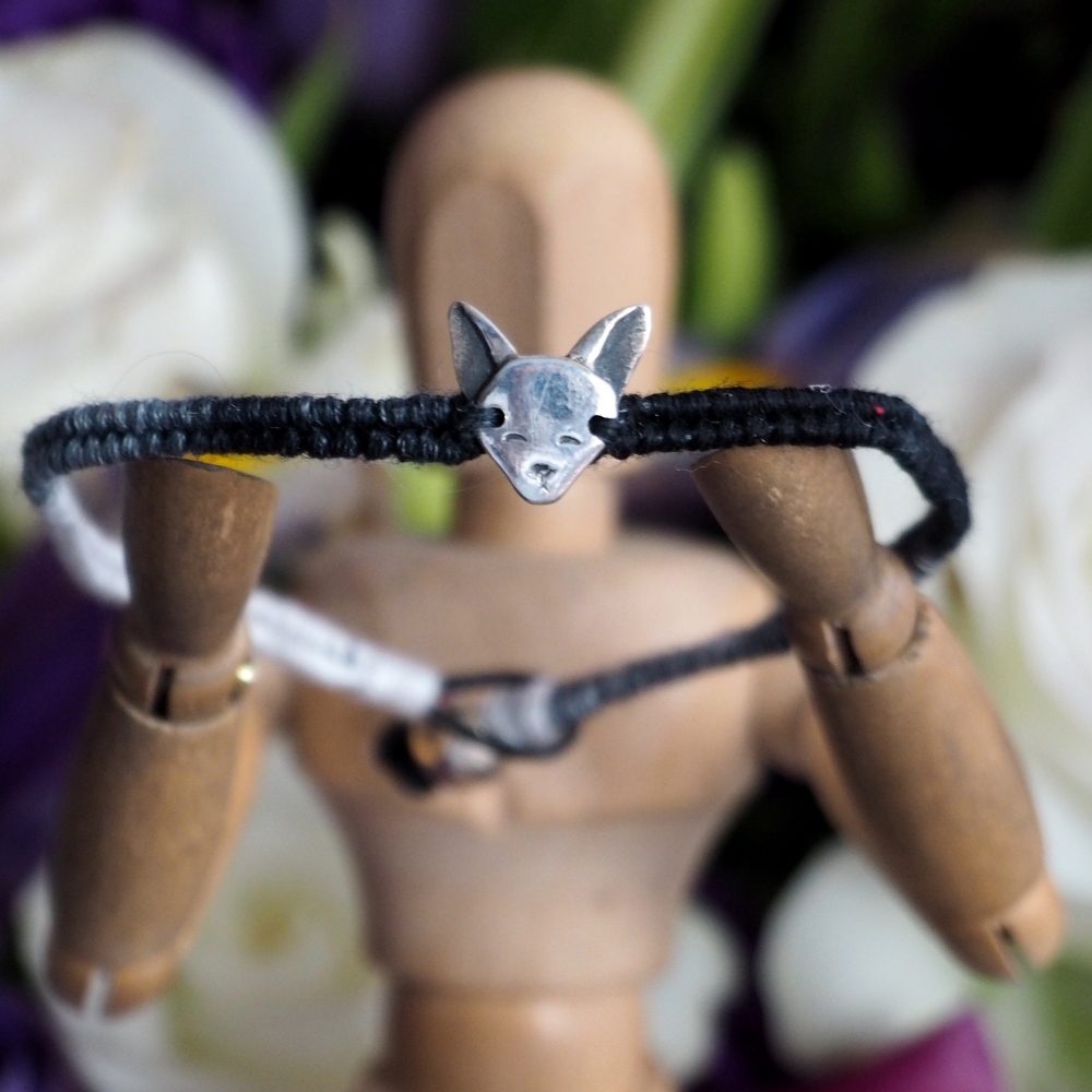 Fine silver Siamese cat charm on a deep grey friendship bracelet