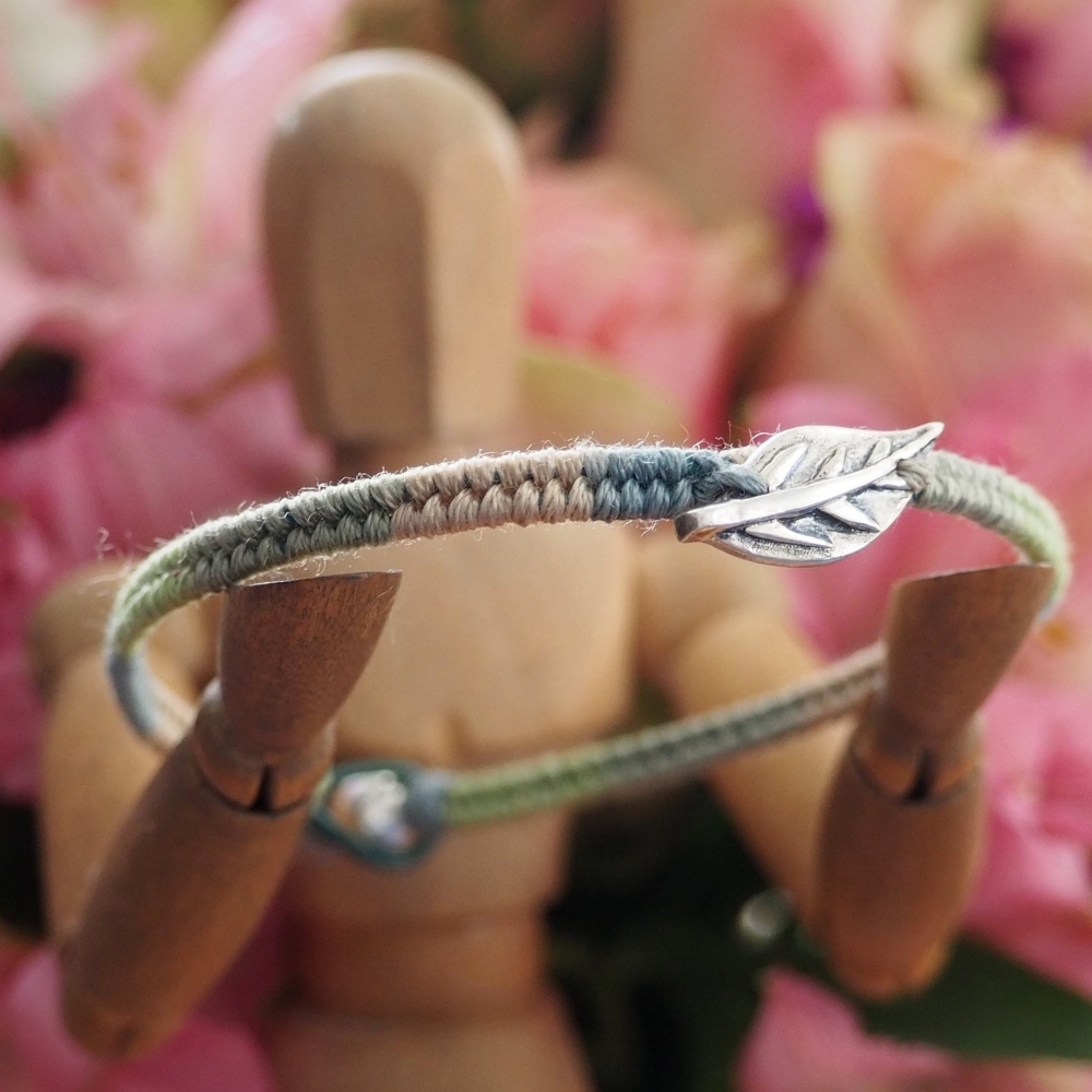 Fine silver leaf charm on a green friendship bracelet