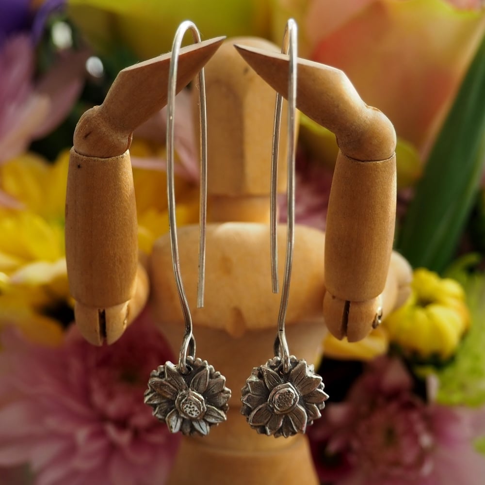 Fine silver sunflower earrings on long hand formed sterling silver wires