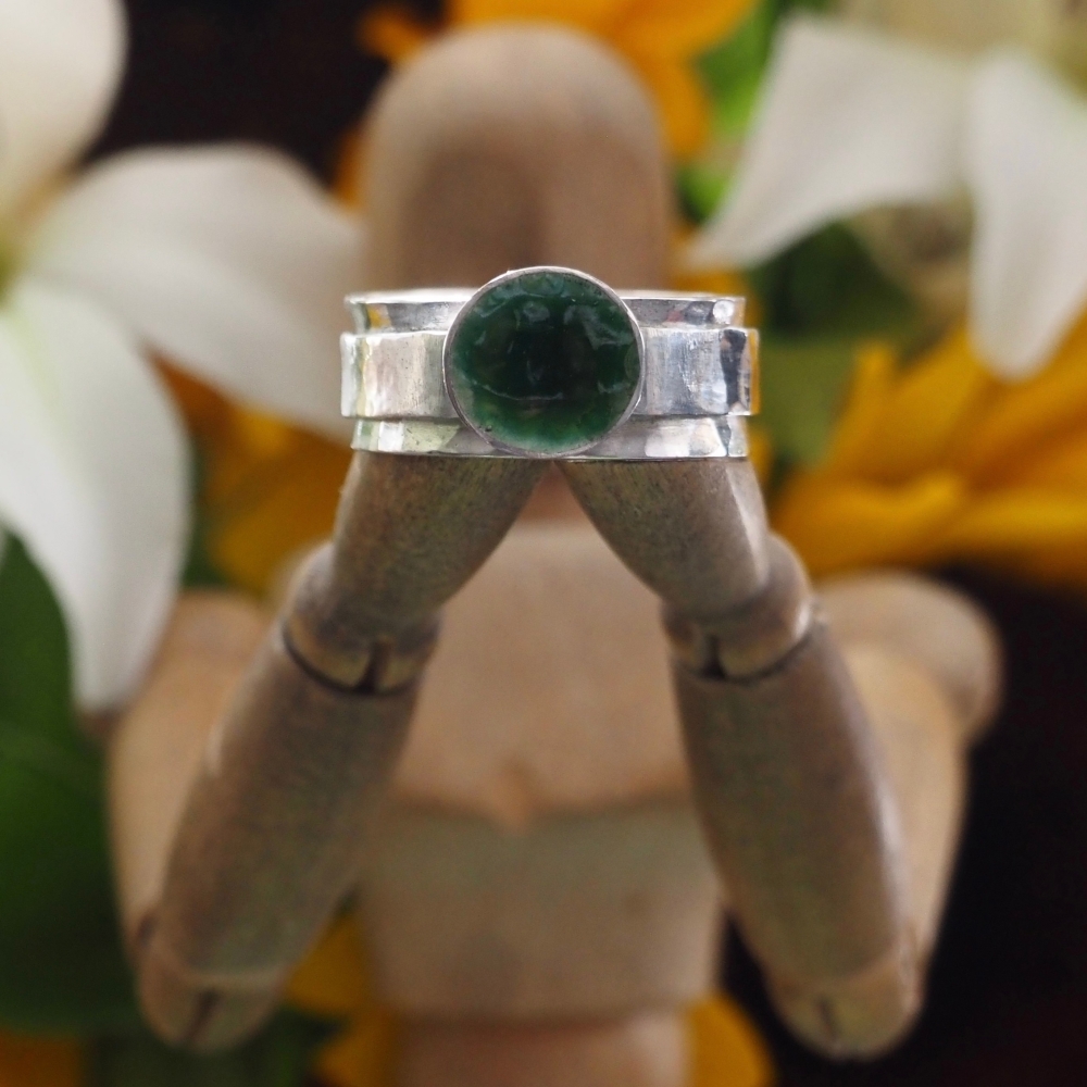 Sterling silver spinner ring with enamelled green cup