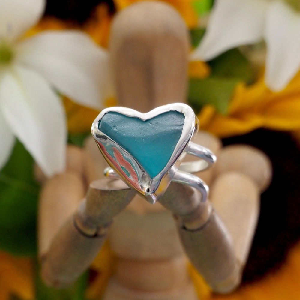 Sterling silver ring with small blue 'sea glass' heart
