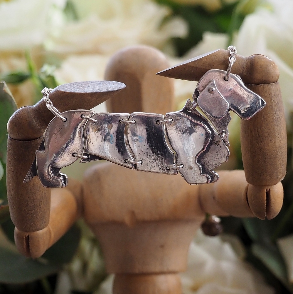 Fine silver articulated wire hair dachshund dog on a sterling silver chain