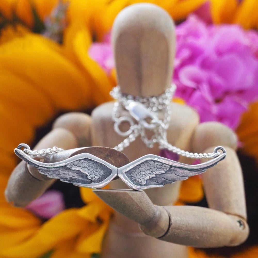 Fine silver angel wings on a sterling silver chain