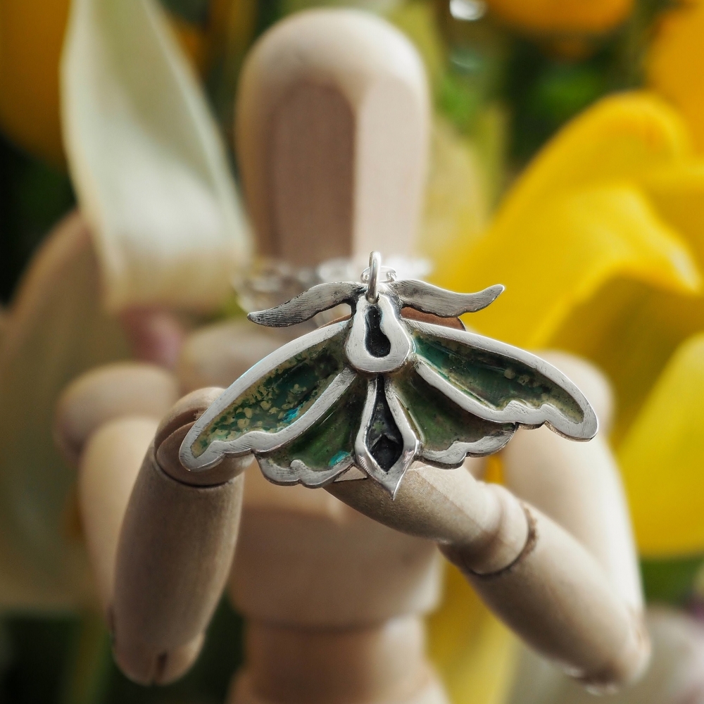 Fine silver enamelled moth on a sterling silver chain