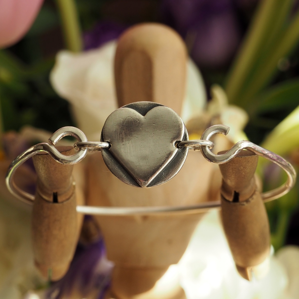 Sterling silver beaten bangle with fine silver heart