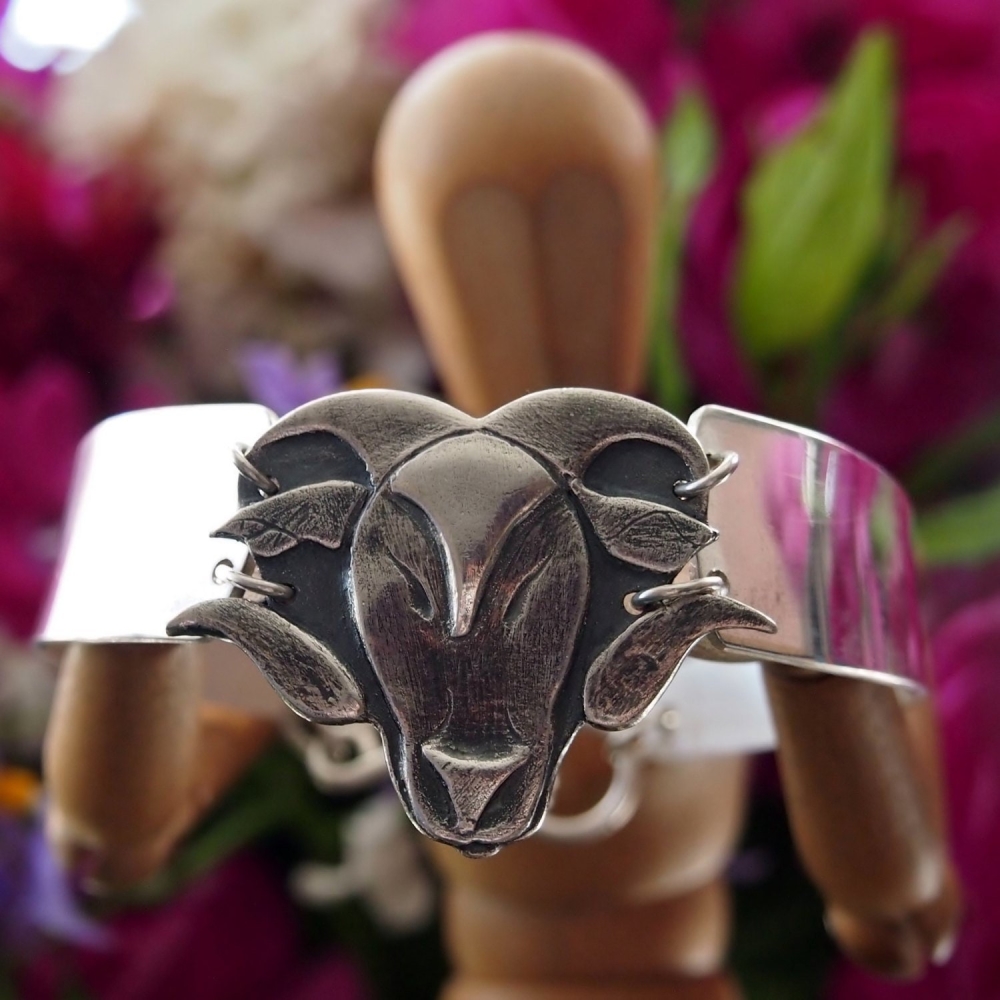 Sterling silver bangle with fine silver rams head