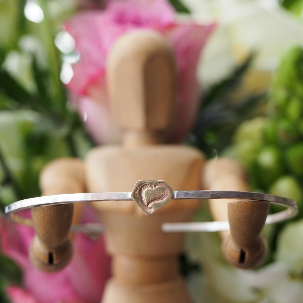 Sterling silver bangle with brass stamped with a heart