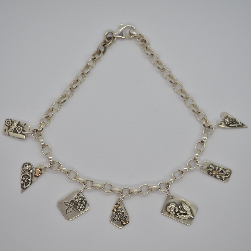 Hand formed chain with recycled silver and gold charms