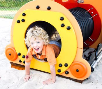 image 1 - blonde lad smiling in train