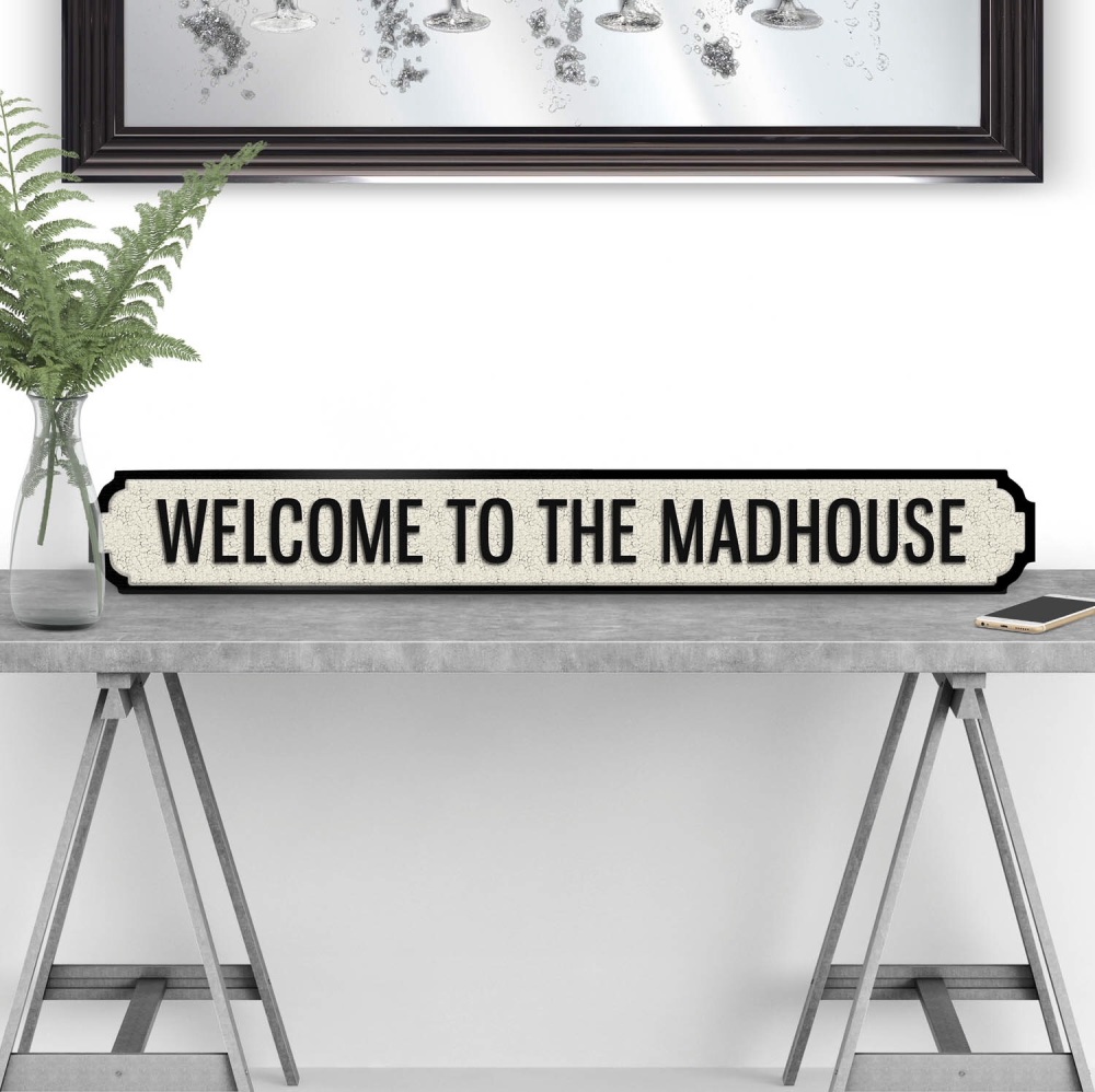 Welcome To The Madhouse street sign