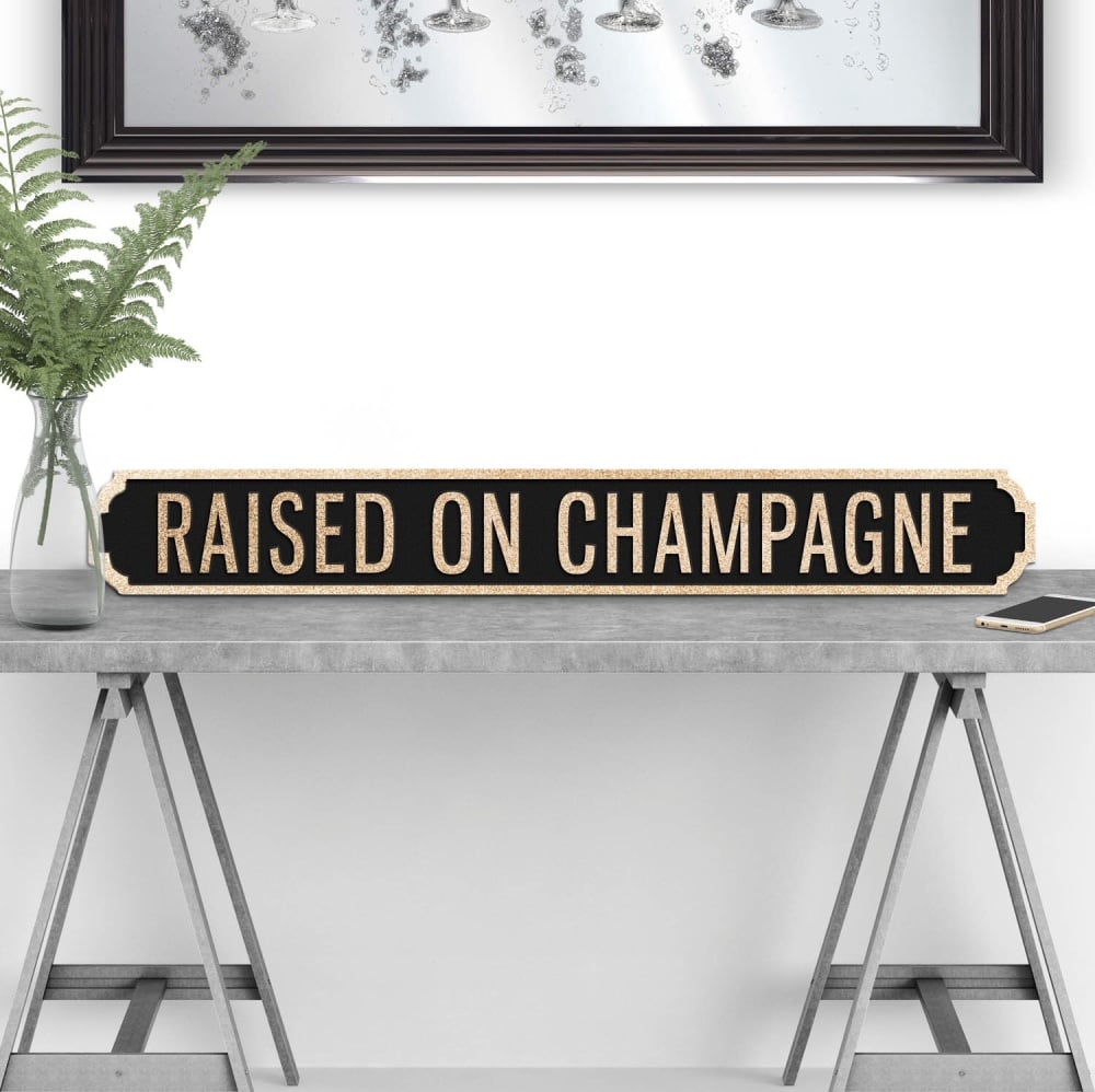 Raised on Champagne Street sign in Black & Gold