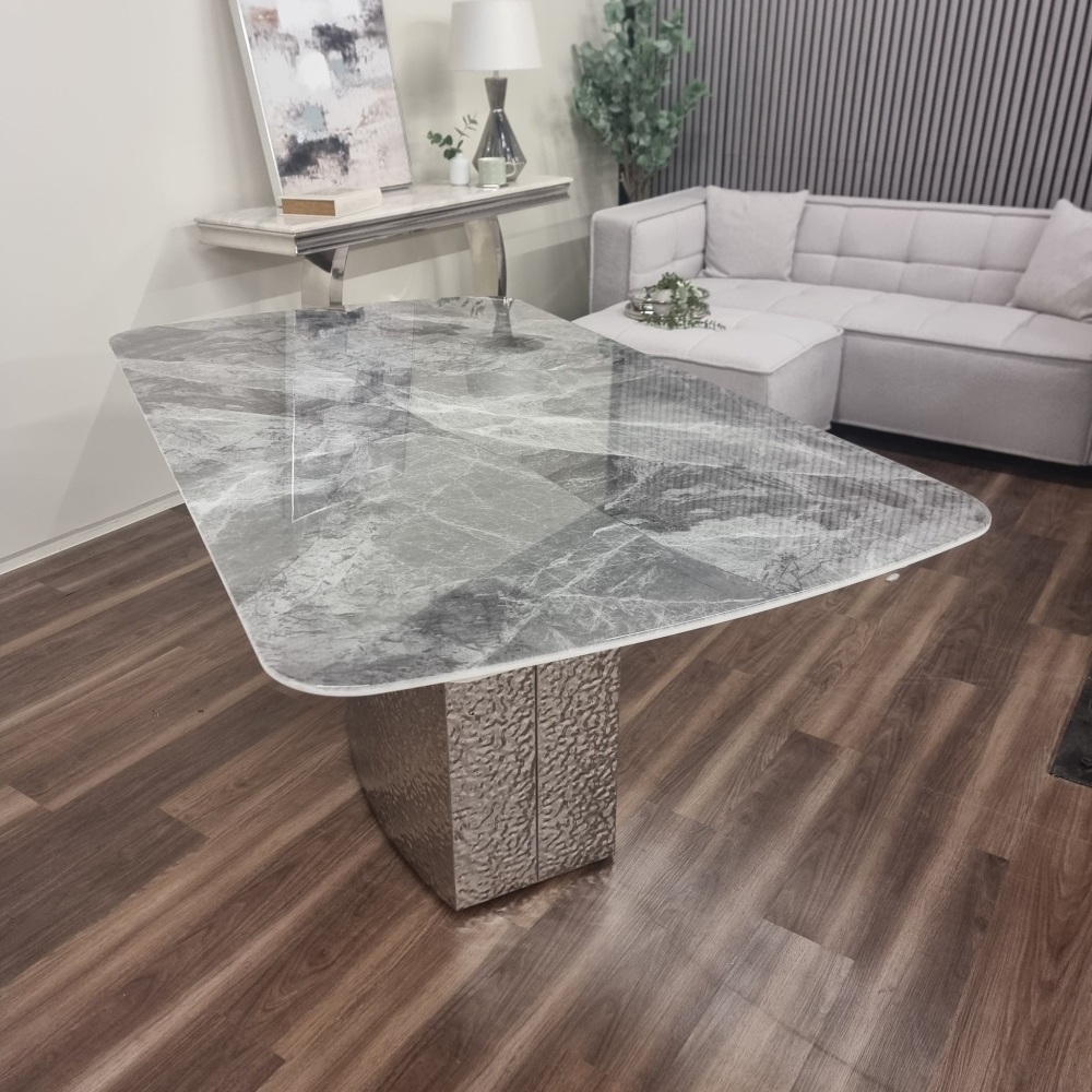 Brand new Roma Dining Table features a beautiful marble top sitting on a ha