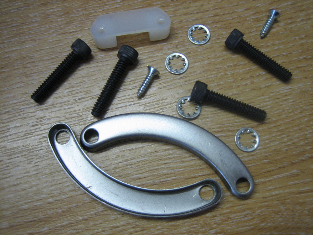 Stator Mount Kit includes lock plates, plug retainer, and hardware Fits