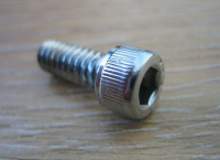 #7  Locking  Allan cap screw for locking the sprocket nut in place Grade 8 Tensile 3/16