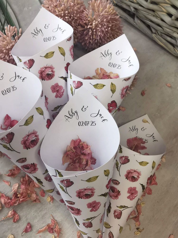 Personalised pink flower wedding confetti cones.
