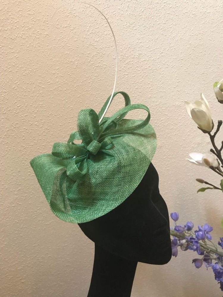 Unique fern green fascinator with single quill