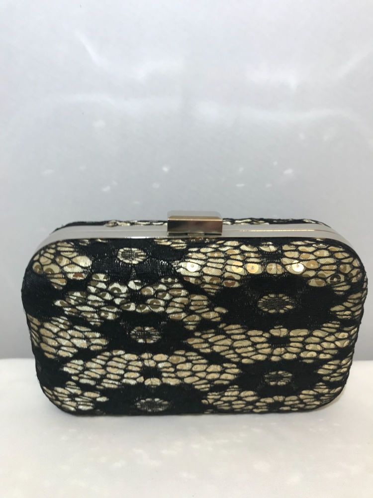 Small black and gold hard case clutch bag