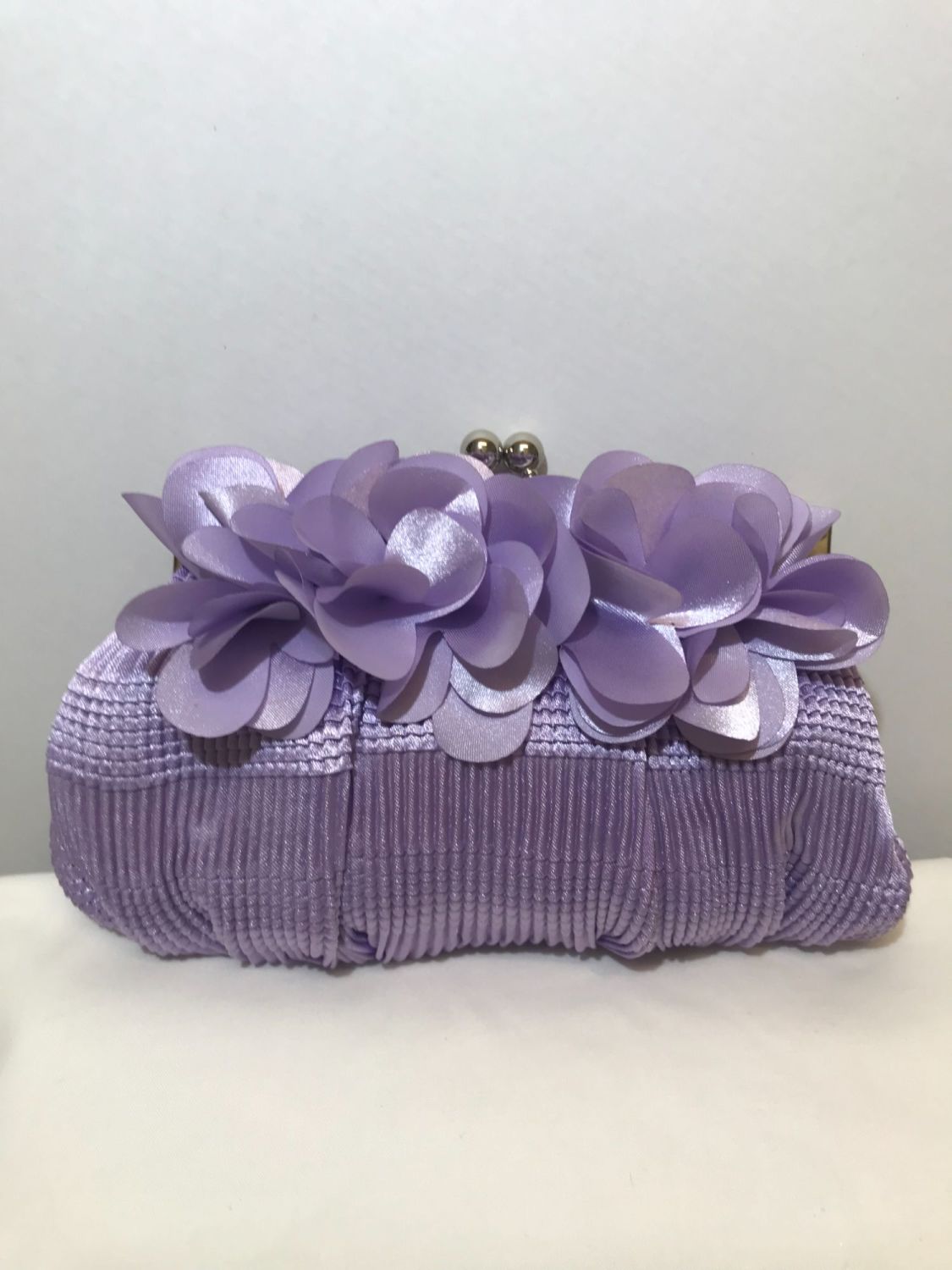 mauve clutch bag