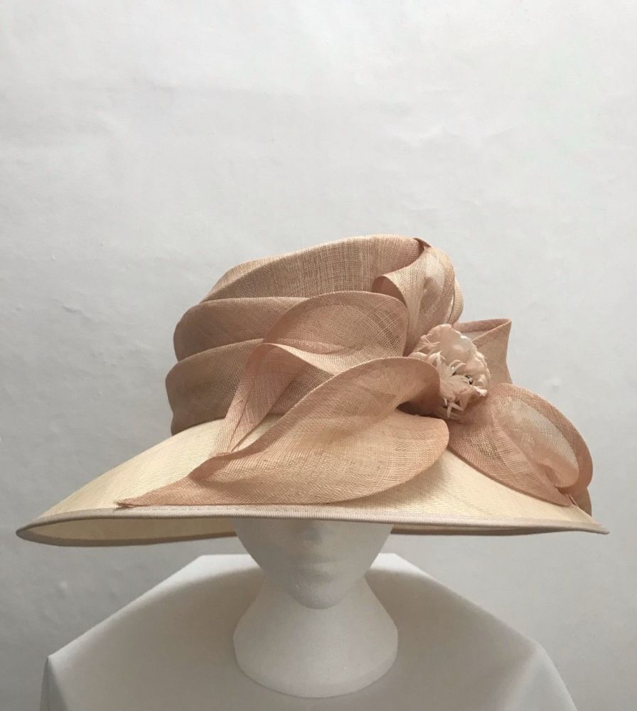 Large extravagant apricot and cream hat