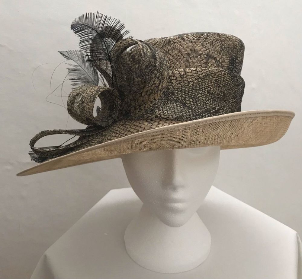 Medium size cream hat with a black lace overlay