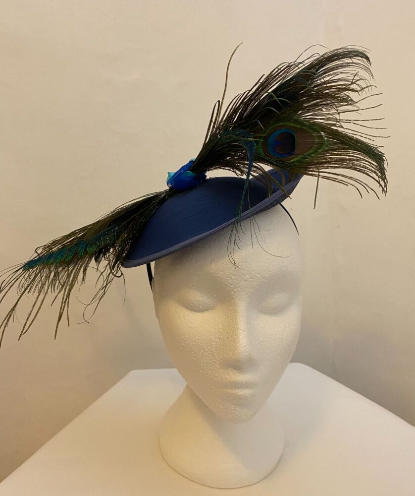 Small colbalt hatinator with peacock feather decoration