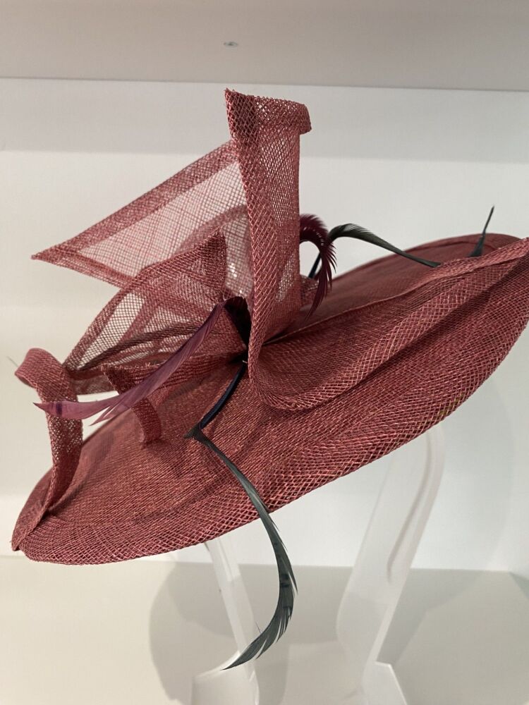 Unique damson fascinator with contrast fabric lining