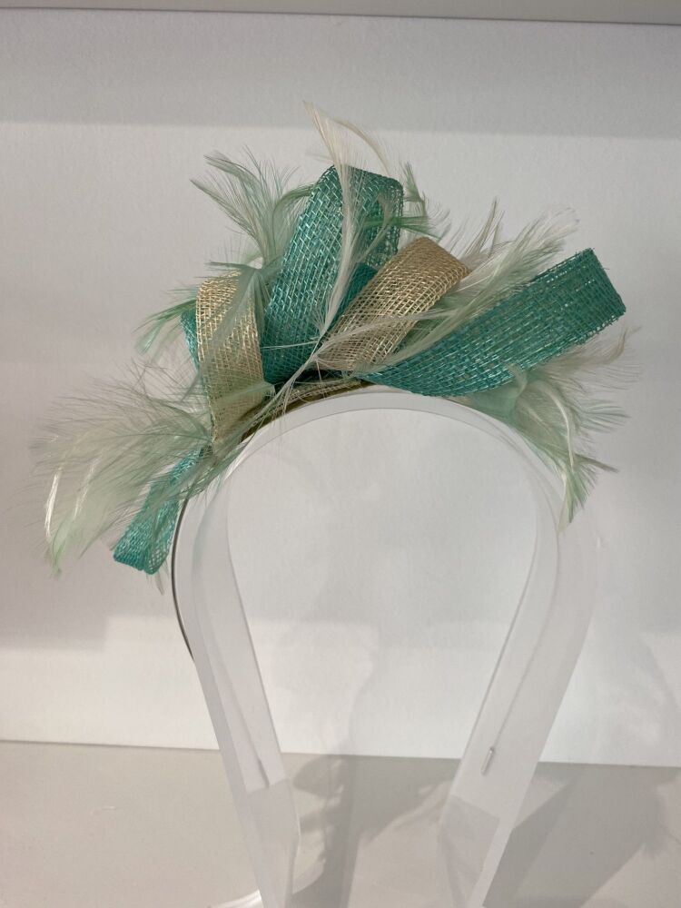 Wrap over style fern and champagne fascinator