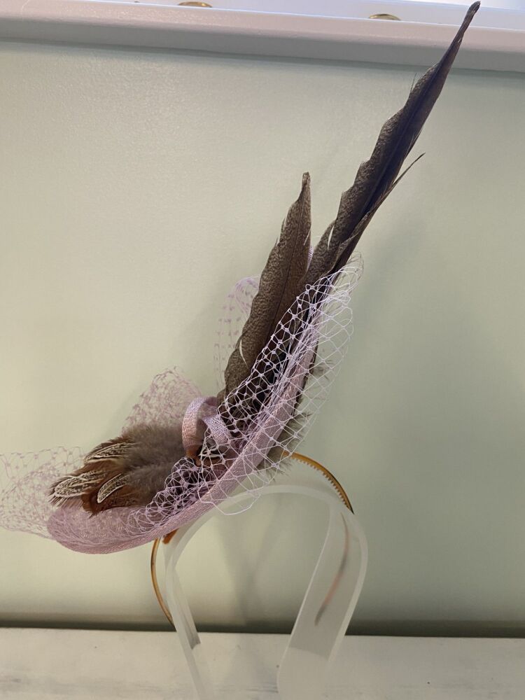 Pink handmade fascinator with brown pheasant feathers