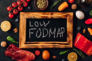 Low-Fodmap-diet-concept.-Low-fodmap-ingredients-on-black-background.-135293