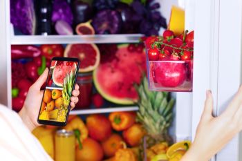 Vegan-vegetarian-woman-female-opens-full-fridge-of-fruits-and-vegetables-10