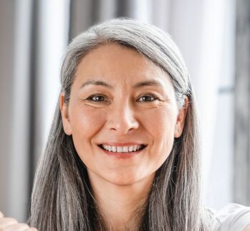 Sporty-caucasian-mature-grey-haired-woman-during-fitness-with-dumbbells,-cl