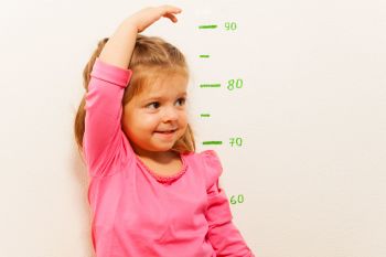 Height-measurement-by-little-girl-at-the-wall-506355098_2125x1416 (1)