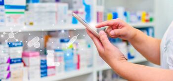 Pharmacist-using-mobile-smart-phone-for-search-bar-on-display-in-pharmacy-d