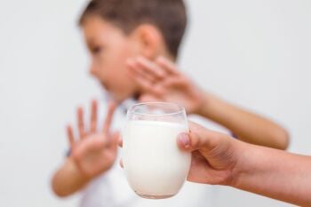Kid-refusing-to-drink-milk.-Lactose-intolerance.-Dairy-Intolerant-child-ref