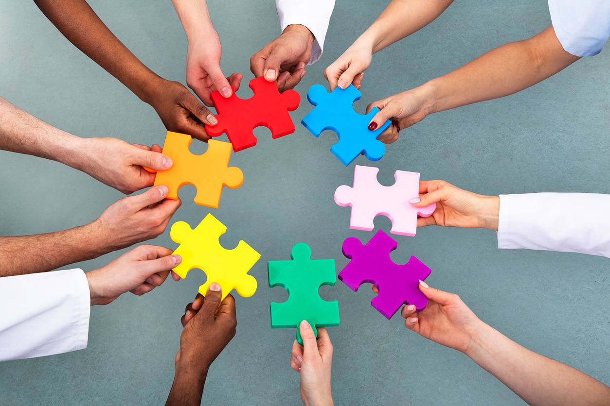 High-Angle-View-Of-Medical-Team-Solving-Jigsaw-Puzzle-1157270505_1258x838.jpeg