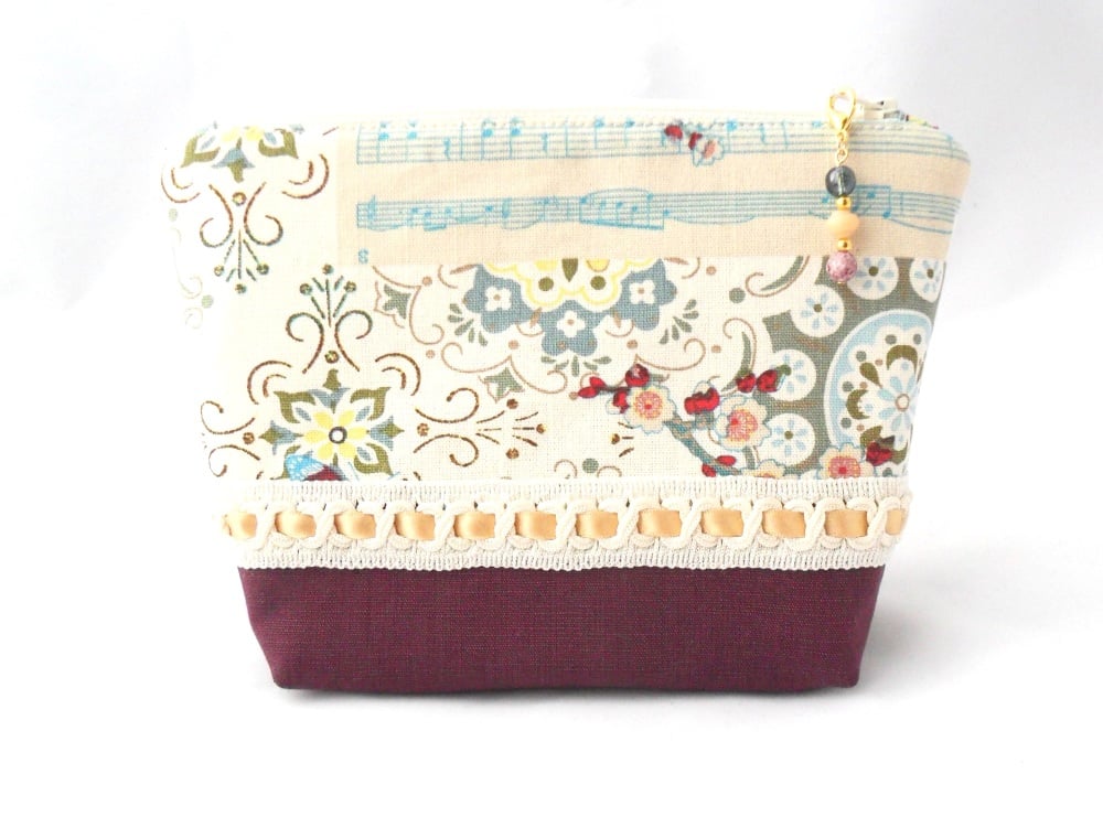 Make-up bag in berry, blue and gold