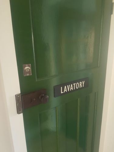 Lavatory door plaque