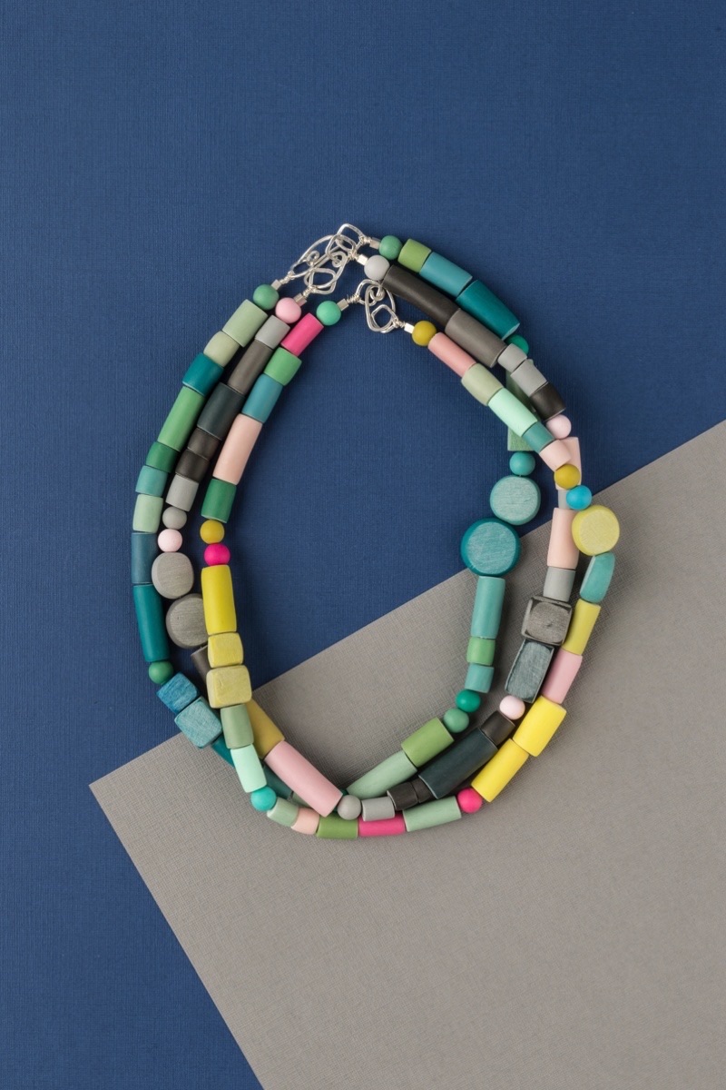 Colourful handmade statement necklace with random shaped multi colour beads by Clare Lloyd Jewellery