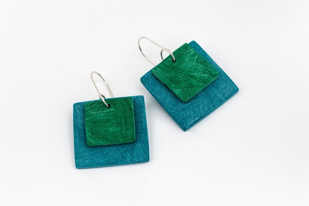 Handmade statement eco sterling silver earrings with large square polymer clay shapes in teal and emerald green
