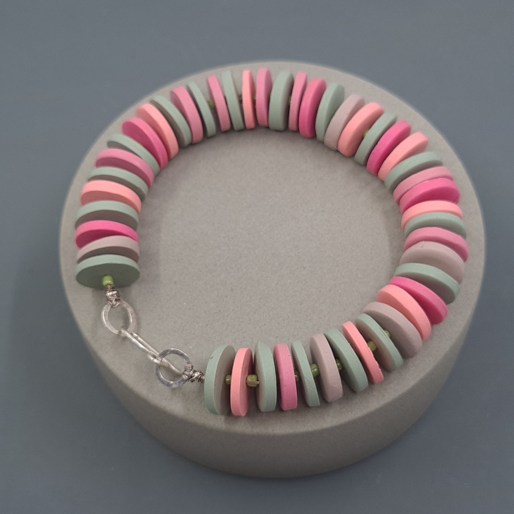 Bracelet with disc beads in pink and sage green