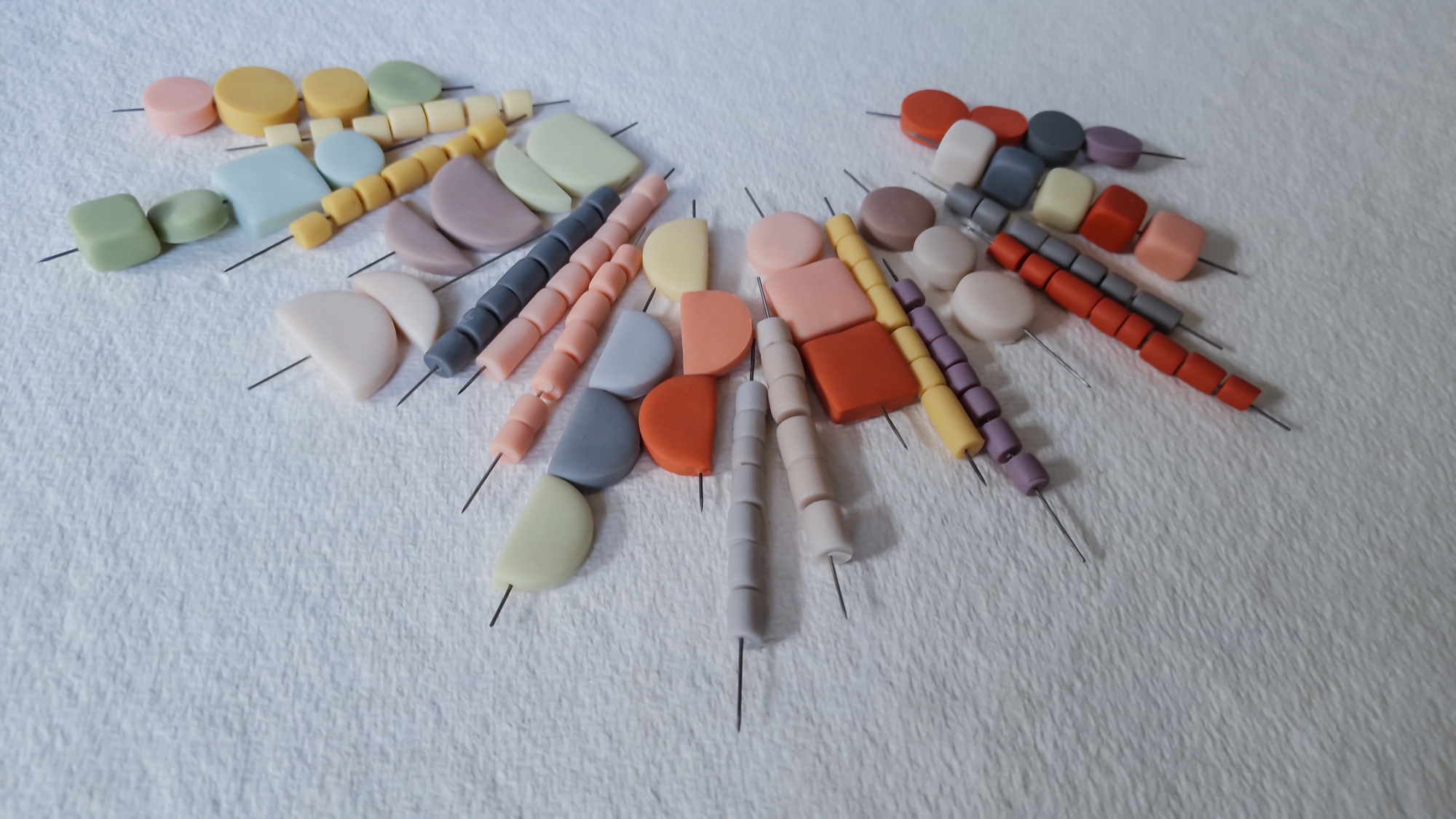 A selection of polymer clay beads made with artists powdered pigments by Clare Lloyd