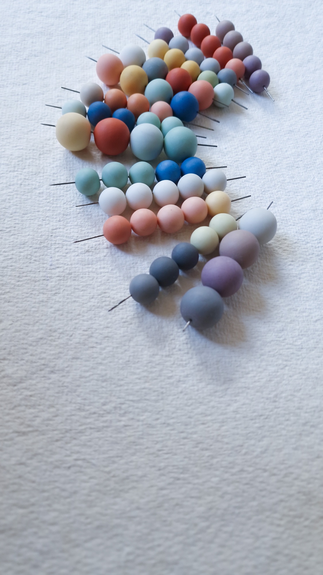 Round polymer clay beads after firing