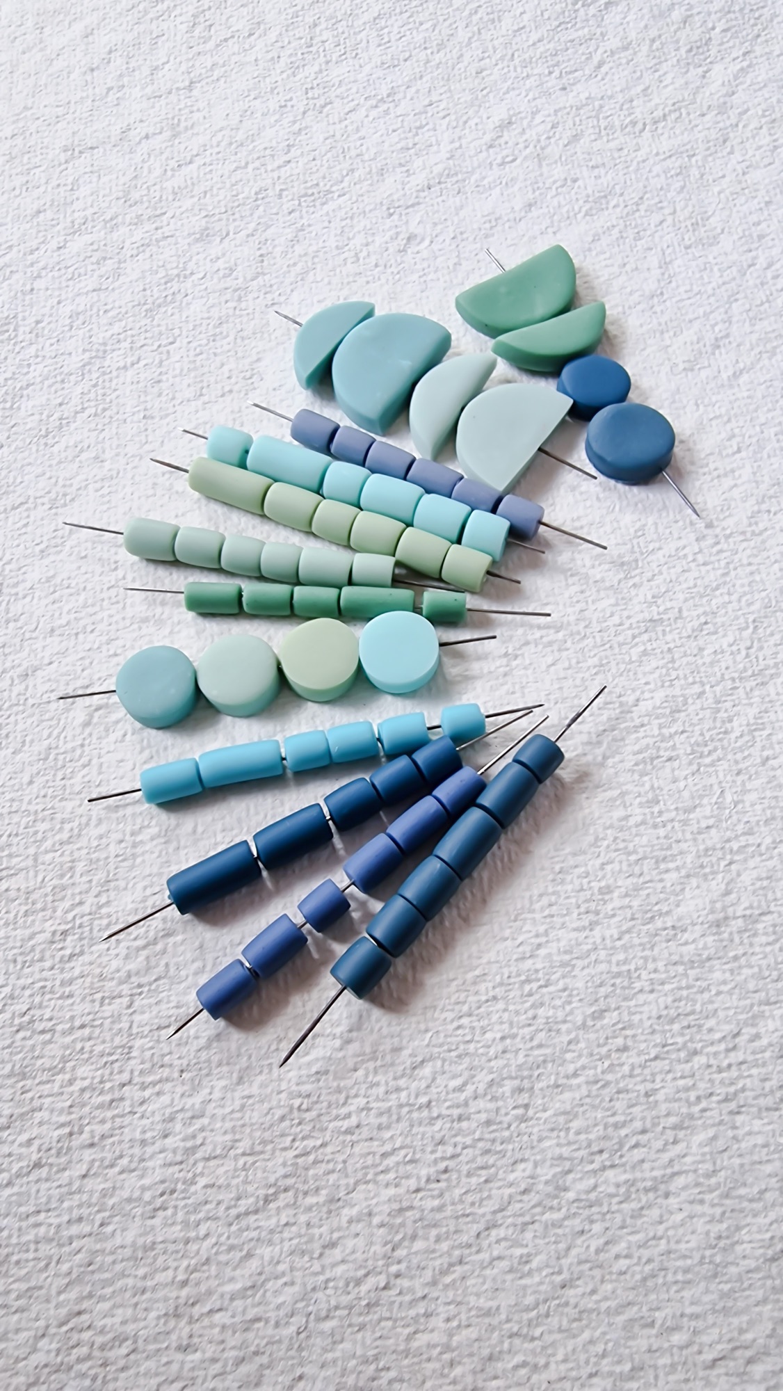 Polymer clay beads amde from indigo and green earth pigments 