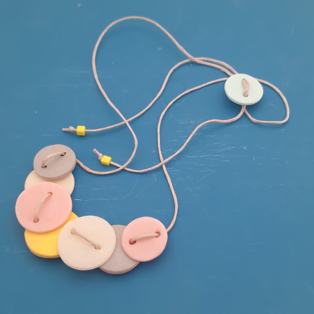 Little Stitched Necklace in pink, yellow, grey and off white