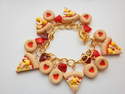 Cheese And Ham Pizza, Jam Biscuit, And Red Heart Charmbracelet