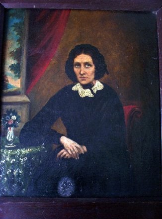 J. Vick, signed verso, Portrait of a seated lady, oil on canvas, dated Oct 1861.