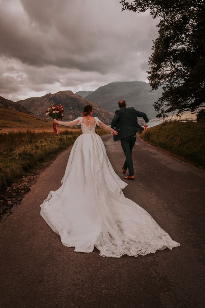 Bride and Groom running in the Lake District