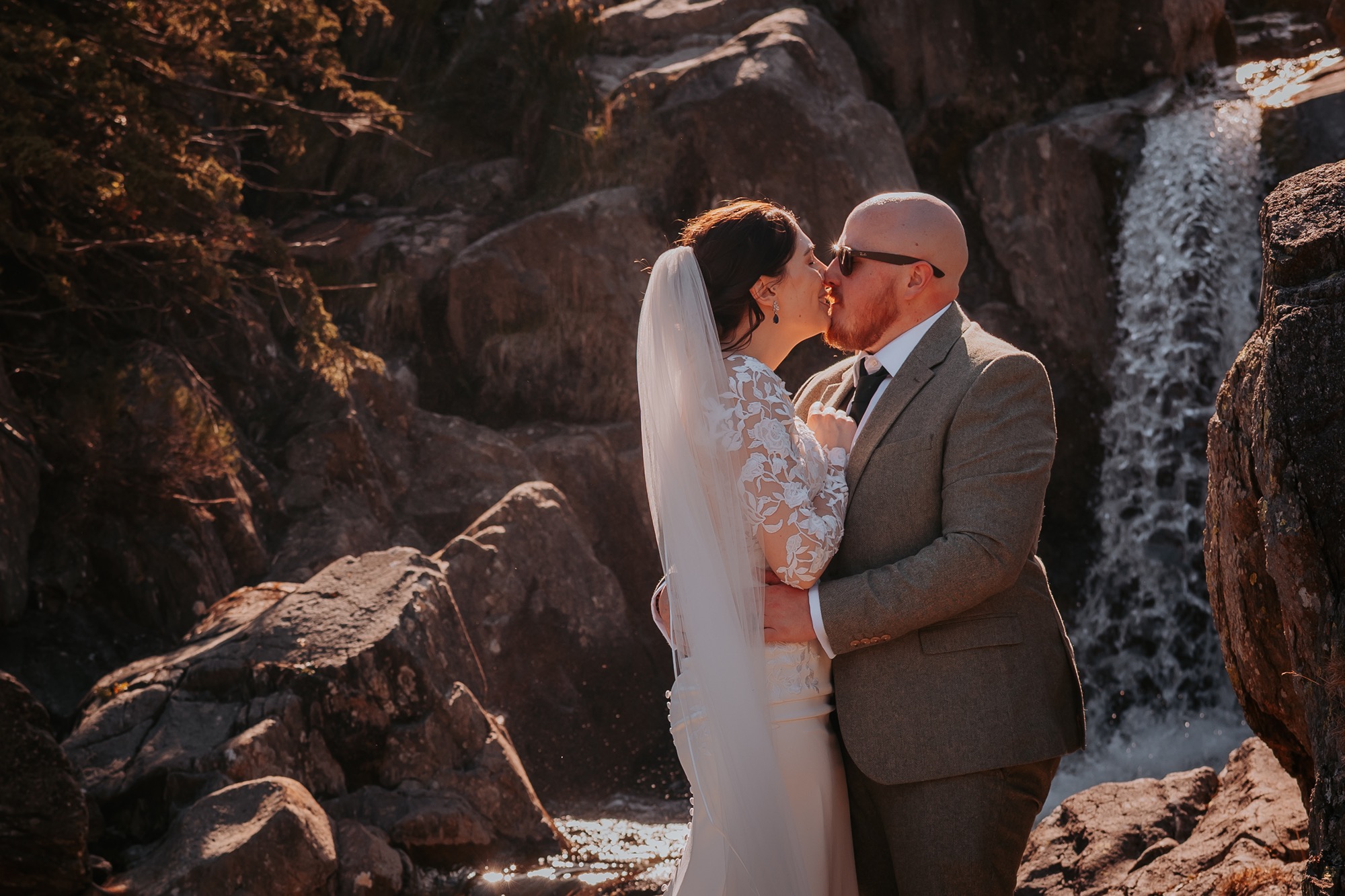 Waterfall kiss, bride and groom wedding day, Coppermines Vallery