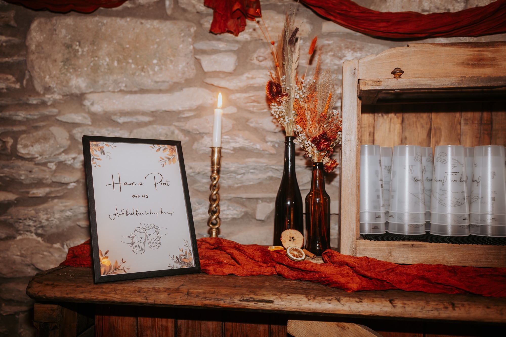 Personalised pint glasses and custom wedding newspapers created by the couple for their Lake District wedding.